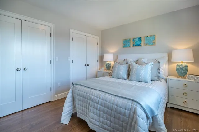 a bedroom with a bed and a closet