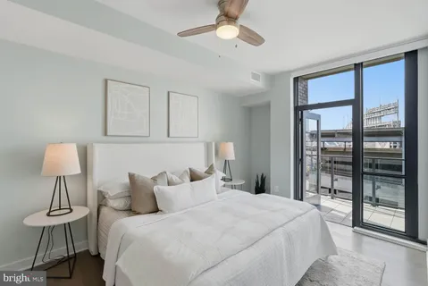 a bedroom with a bed and a lamp on table