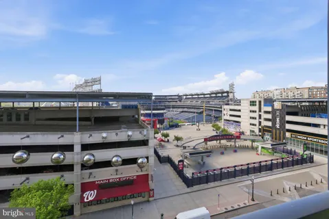 a bathroom with a double vanity sink toilet and mirror