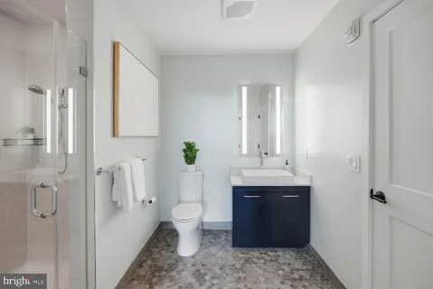 an empty room with a ceiling fan and a window