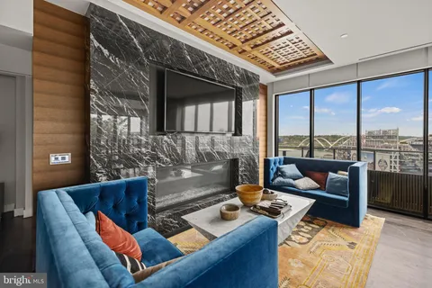 a terrace with seating area and barbeque oven