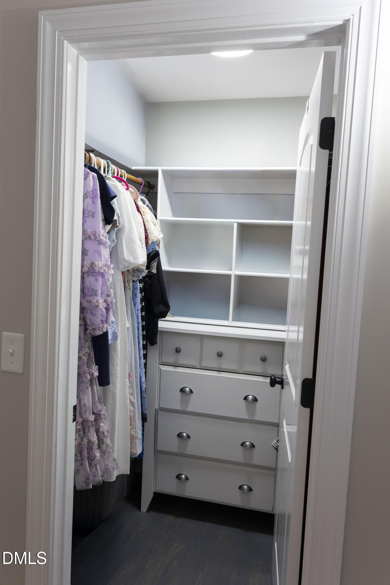 7301 Cleveland School Road Garner, NC 27529 - Photo 22 of 73 a view of walk in closet with clothes and shoes