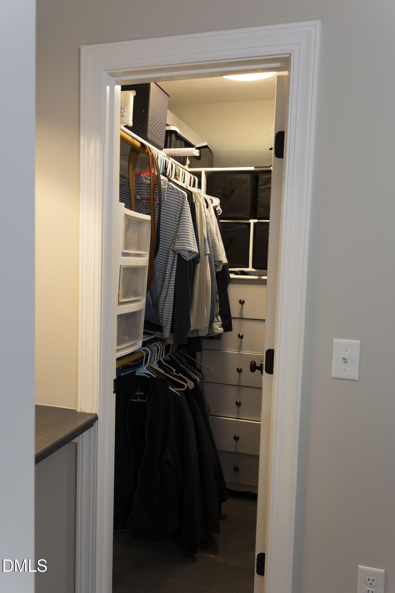 7301 Cleveland School Road Garner, NC 27529 - Photo 23 of 73 a view of walk in closet with clothes and shoes