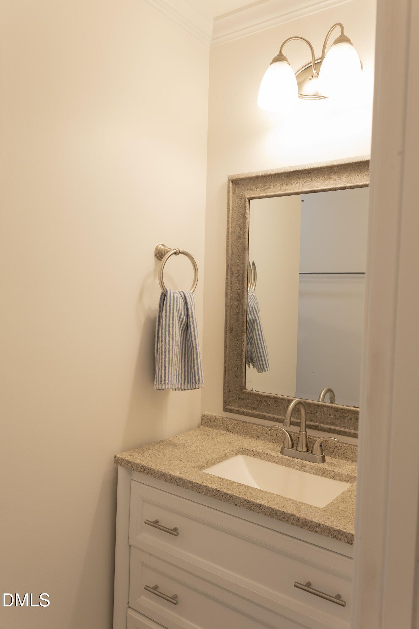 7301 Cleveland School Road Garner, NC 27529 - Photo 27 of 73 a bathroom with a sink and a mirror
