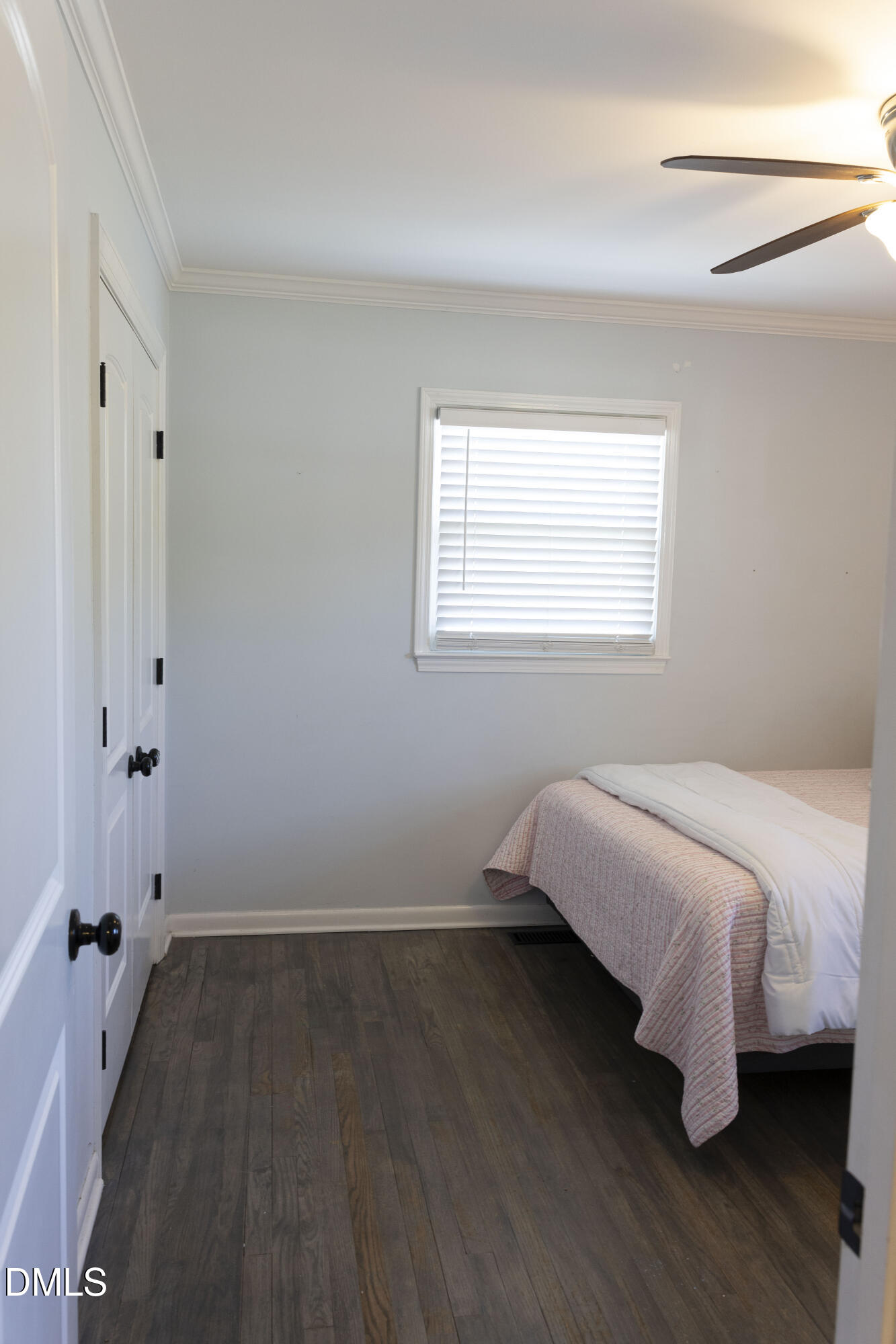 7301 Cleveland School Road Garner, NC 27529 - Photo 36 of 73 a bedroom with a bed and wooden floor