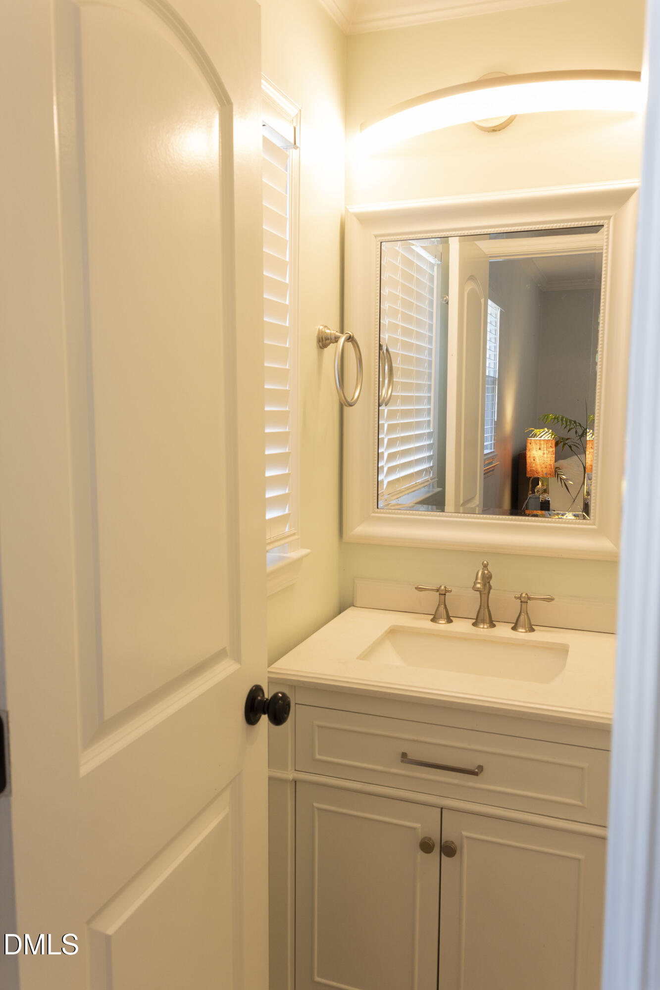 7301 Cleveland School Road Garner, NC 27529 - Photo 39 of 73 a bathroom with a sink and a mirror