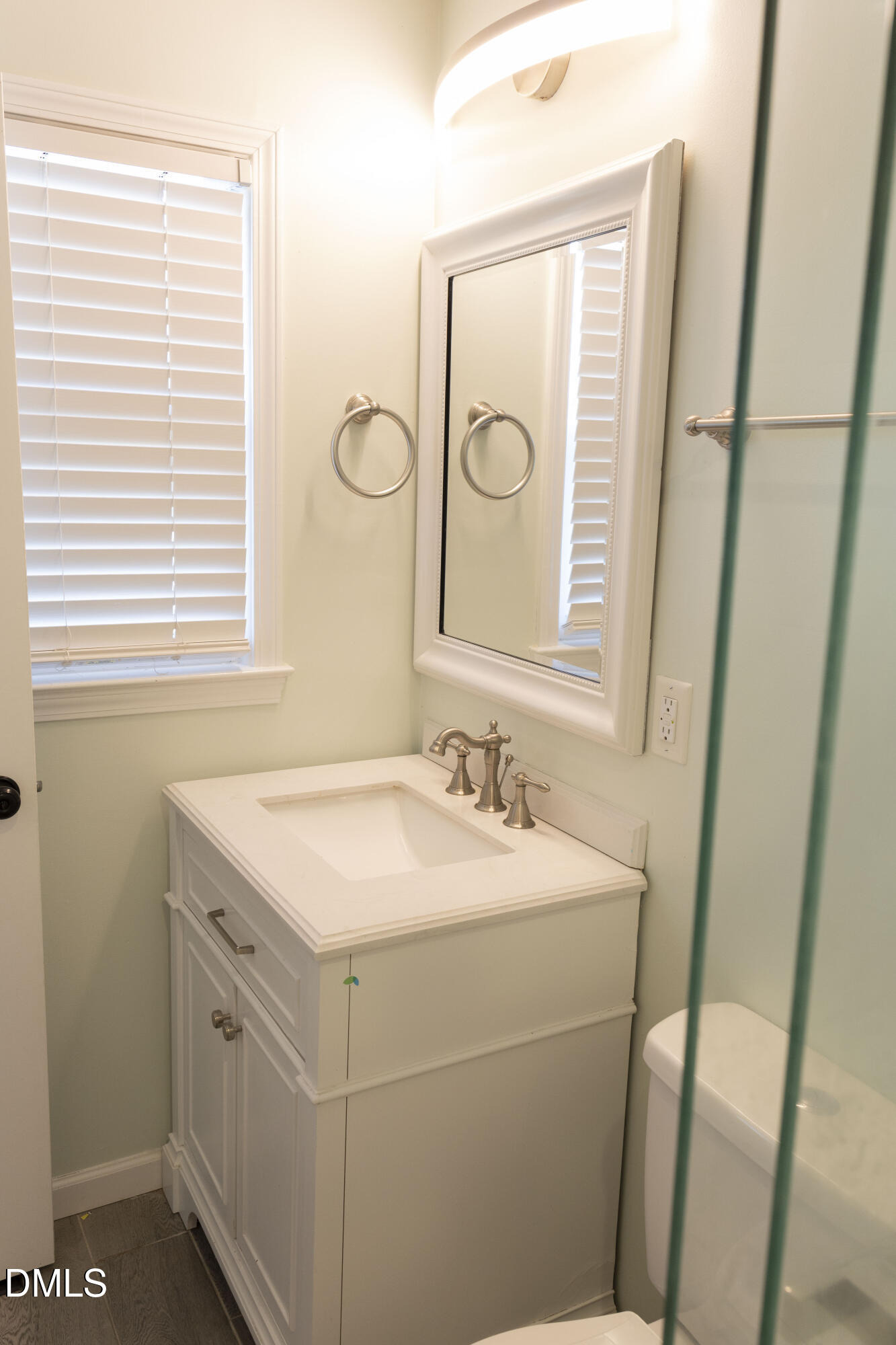 7301 Cleveland School Road Garner, NC 27529 - Photo 43 of 73 a bathroom with a sink and a mirror