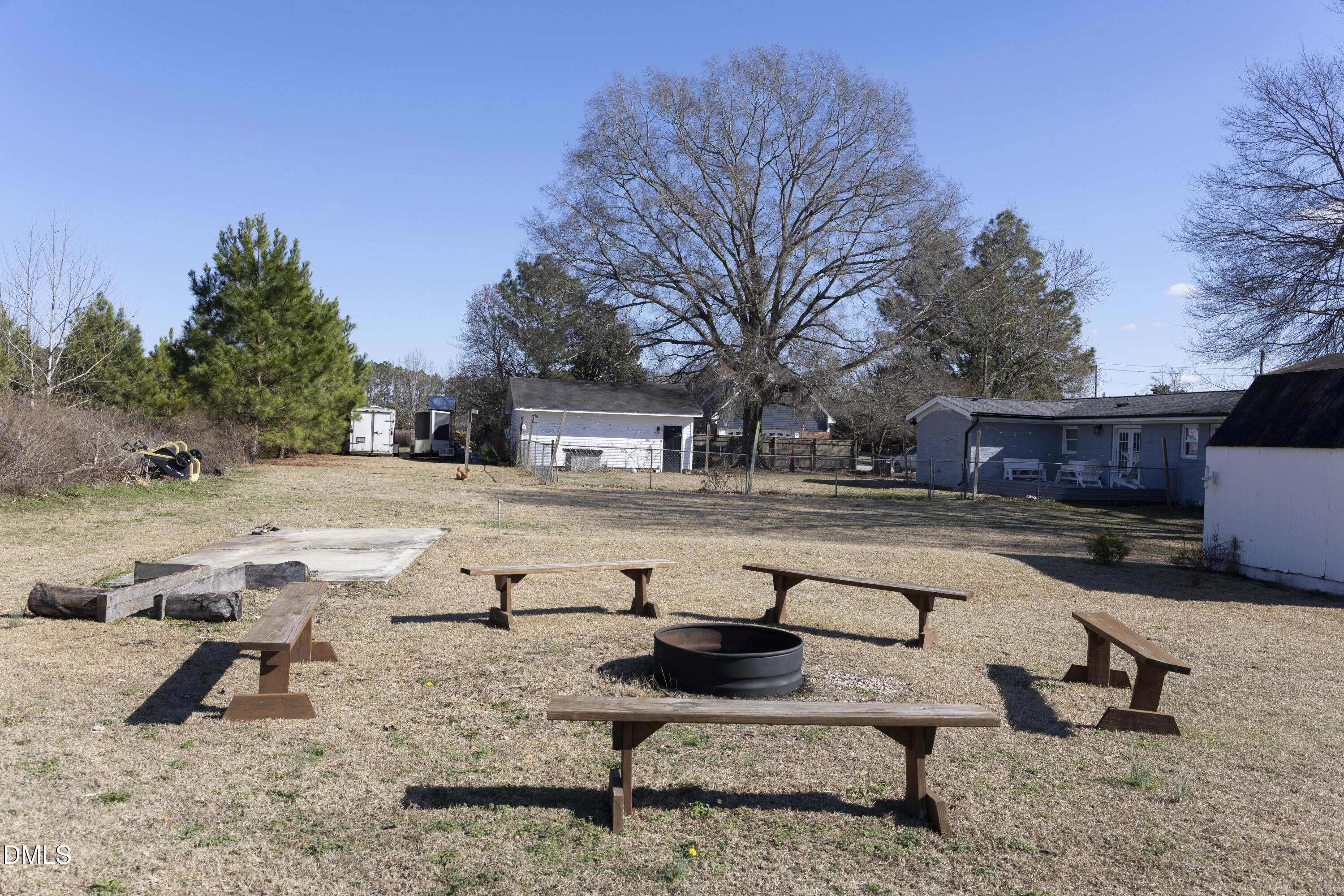 7301 Cleveland School Road Garner, NC 27529 - Photo 64 of 73 a view of swimming pool with outdoor seating and trees in the background
