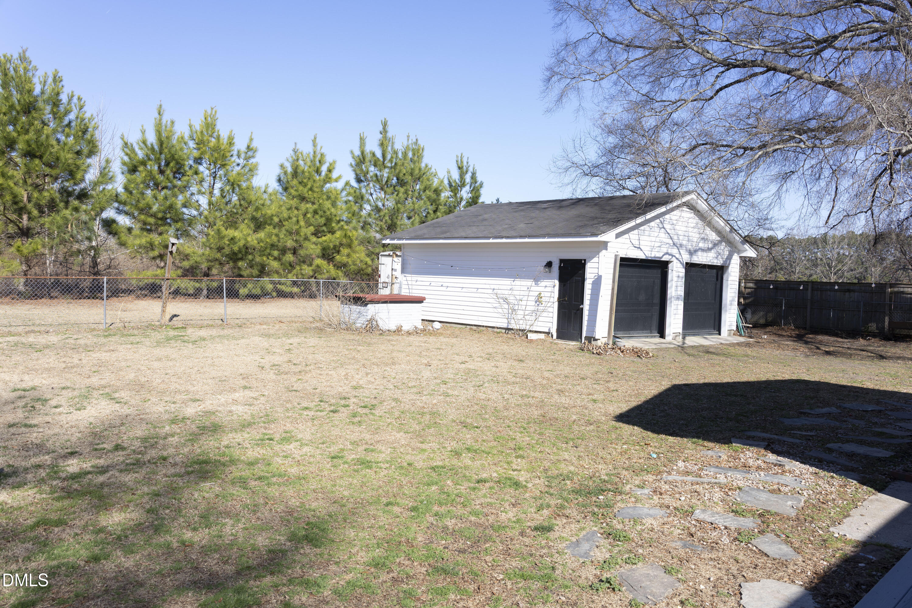 7301 Cleveland School Road Garner, NC 27529 - Photo 69 of 73 a front view of house with yard and trees in the background
