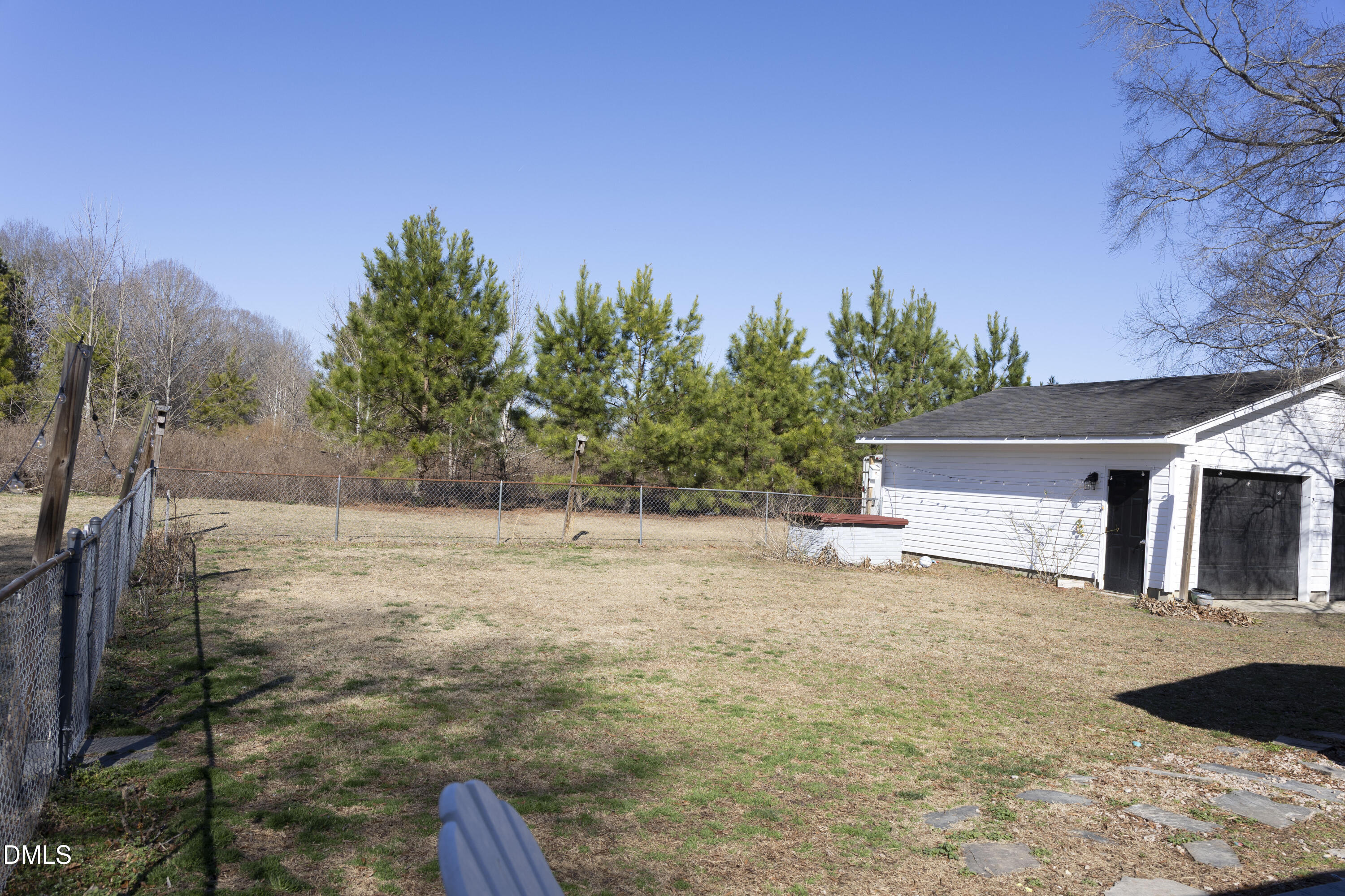 7301 Cleveland School Road Garner, NC 27529 - Photo 70 of 73 a backyard of a house with lots of green space