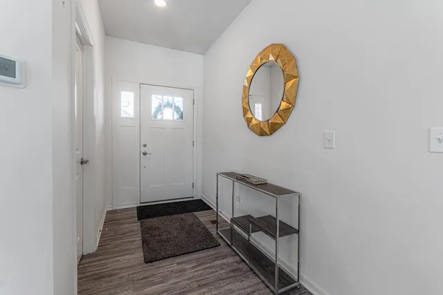 a white toilet sitting next to a bathroom sink