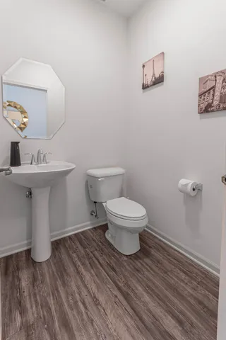 a living room with furniture or wooden floor and a large window