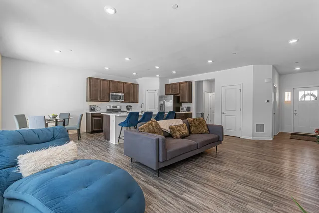a living room with furniture and a large window