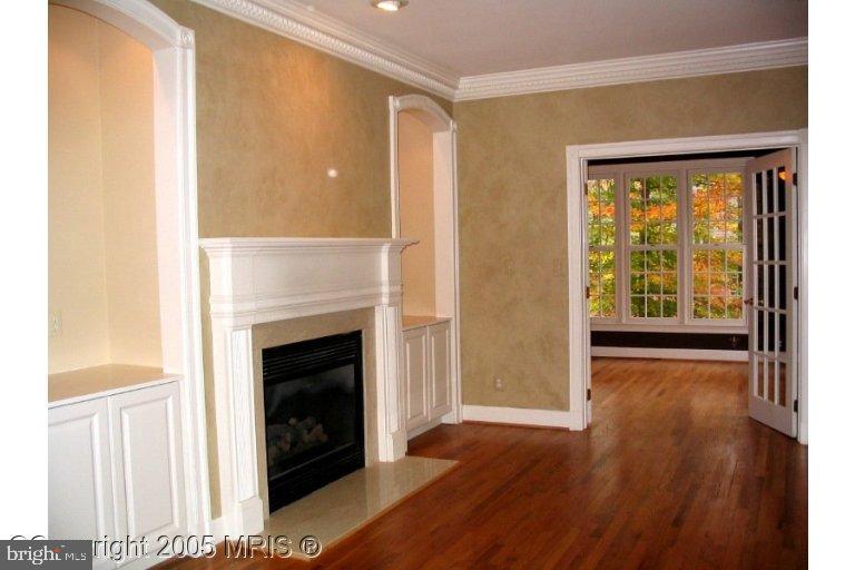 624 Live Oak Drive McLean, VA 22101 - Photo 4 of 10 a view of an empty room with wooden floor and a window