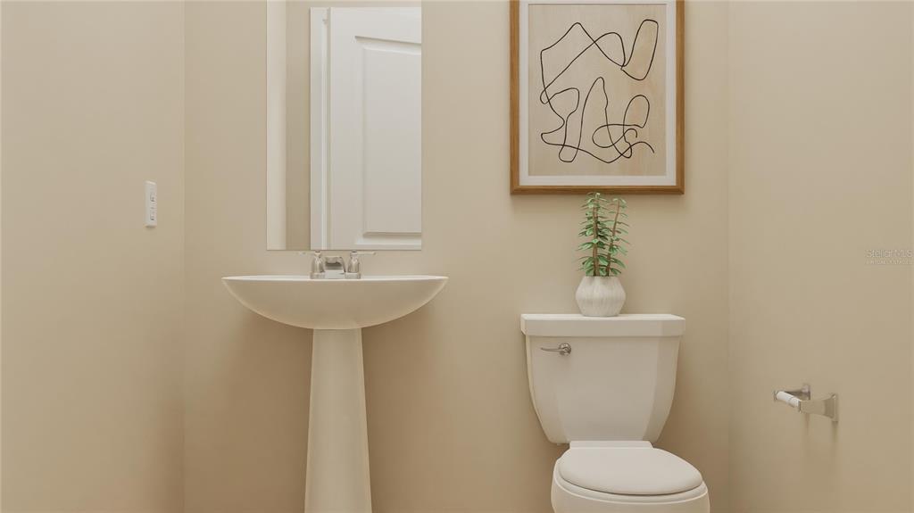 5102 Clay Whaley Road St. Cloud, FL 34772 - Photo 8 of 27 a bathroom with a toilet sink and mirror