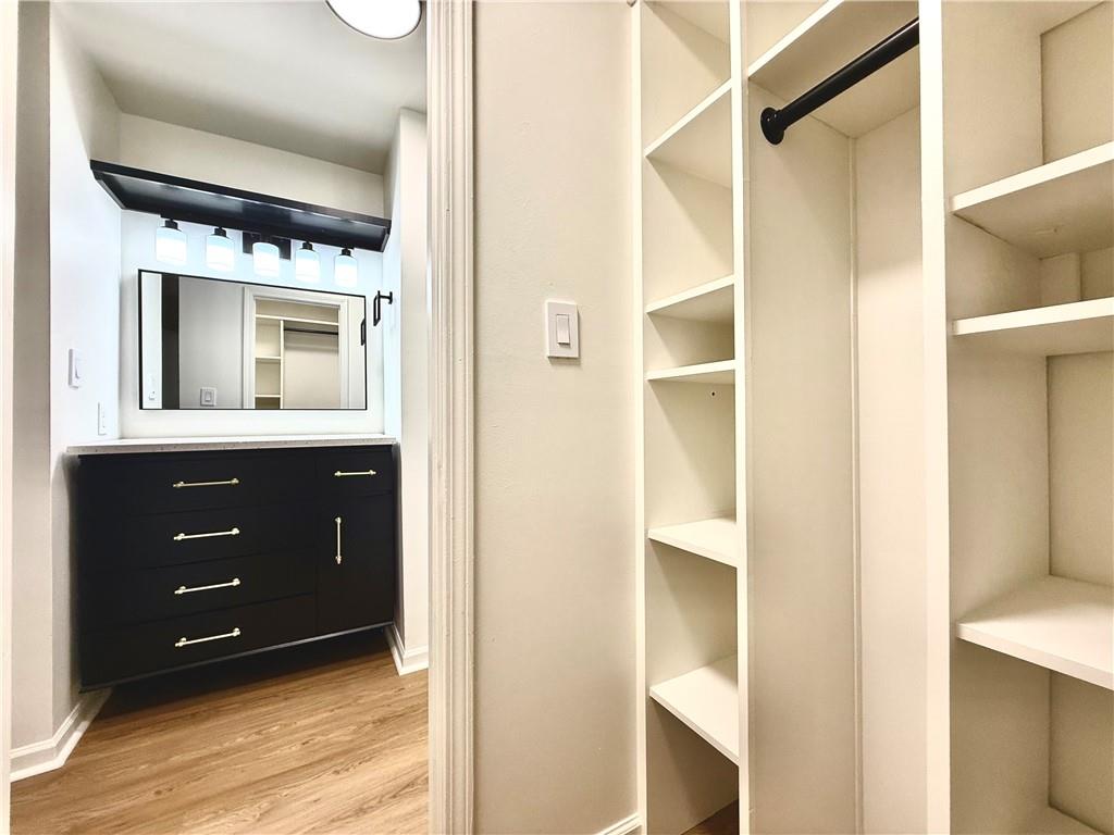 3655 Habersham Road Northeast, Unit A212 Atlanta, GA 30305 - Photo 14 of 21 a bathroom with a sink and a mirror
