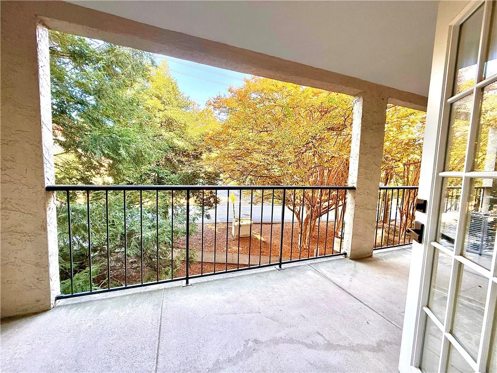 3655 Habersham Road Northeast, Unit A212 Atlanta, GA 30305 - Photo 18 of 21 a view of a room with wooden floor and balcony