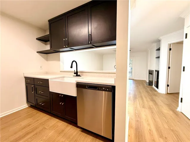 a kitchen with a sink and a refrigerator