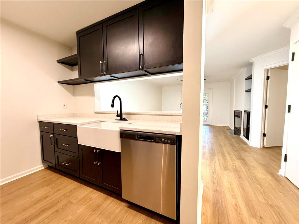 3655 Habersham Road Northeast, Unit A212 Atlanta, GA 30305 - Photo 4 of 21 a kitchen with a sink and a refrigerator