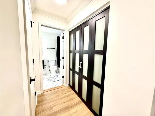 a bathroom with a double vanity sink toilet and shower