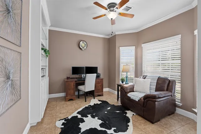 a living room with furniture wooden floor and a window