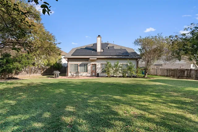 a front view of house with yard outdoor seating and green space