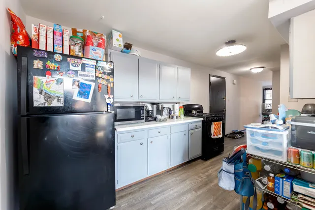 a kitchen with counter top space cabinets and appliances