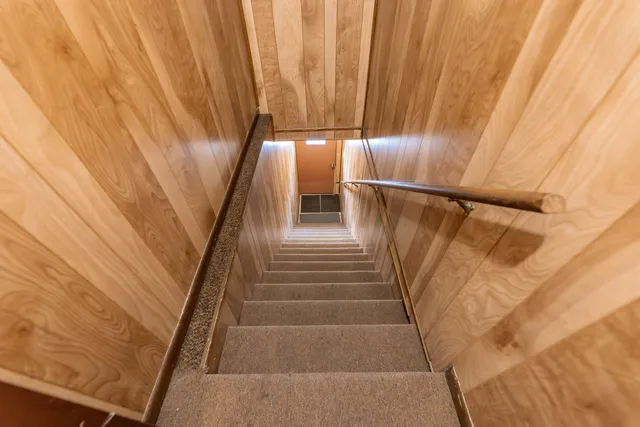 a view of a patio with table and chairs