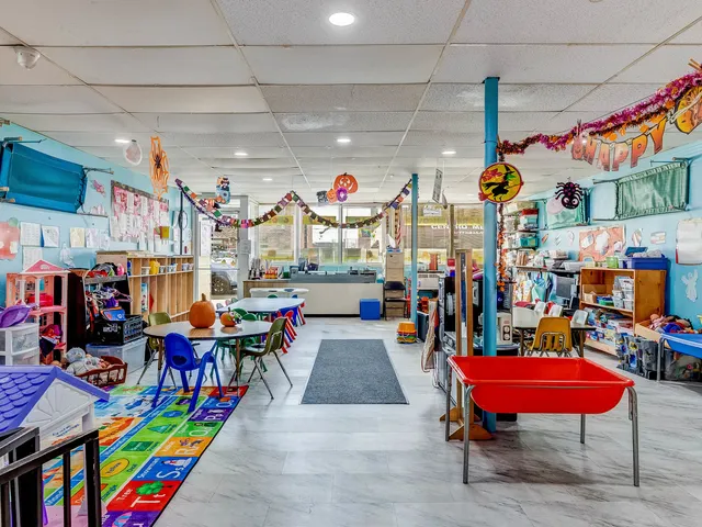 a group of people sitting outside of a building