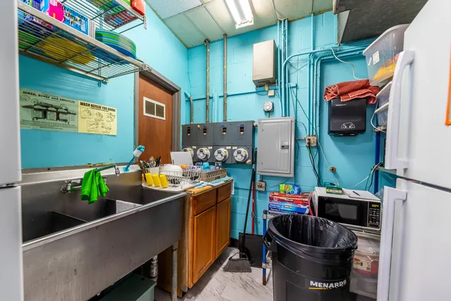 a room filled with furniture and a potted plant