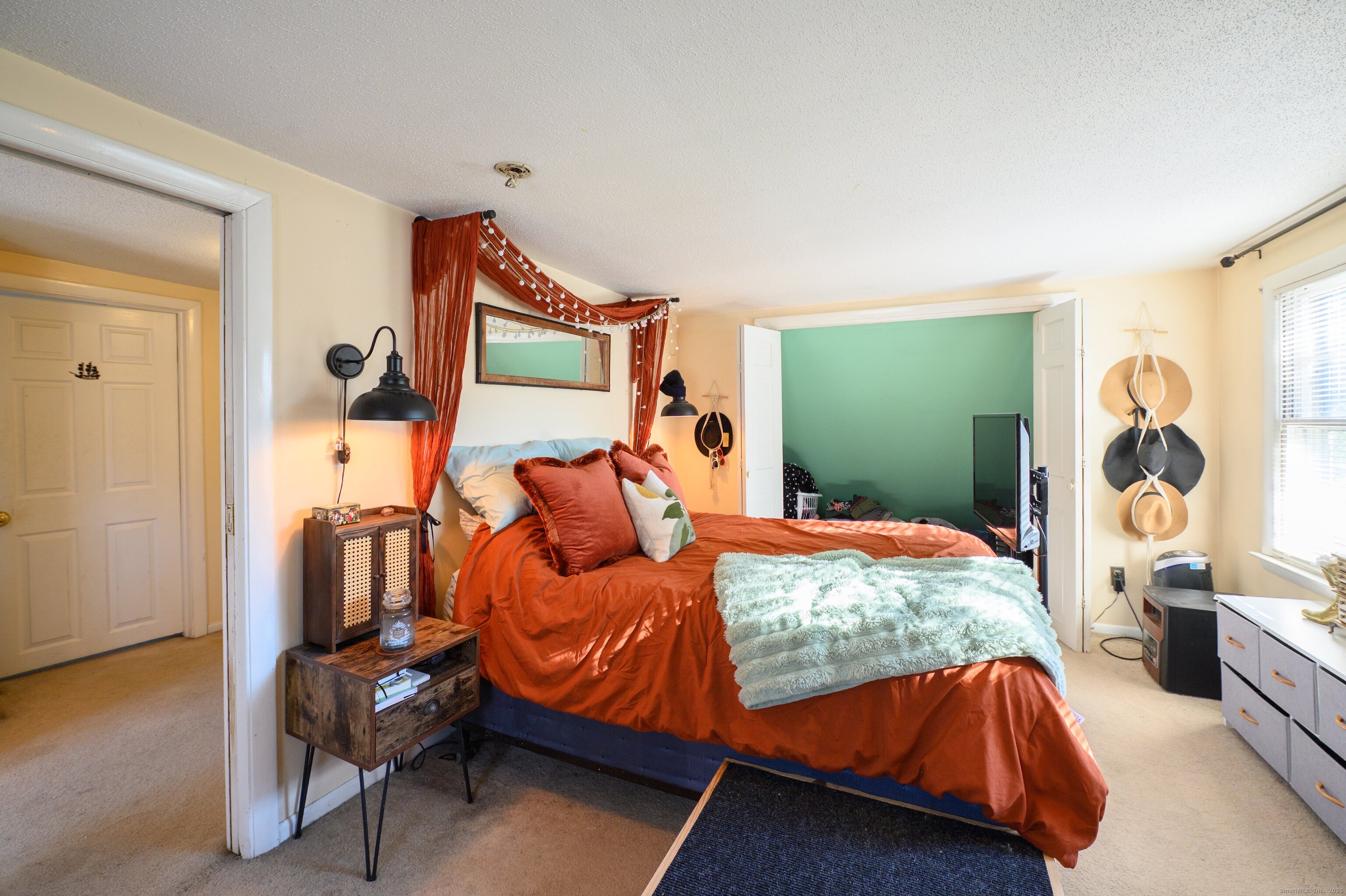 1940 Mt Vernon Road Southington, CT 06489 - Photo 16 of 24 a bedroom with a bed and wooden floor