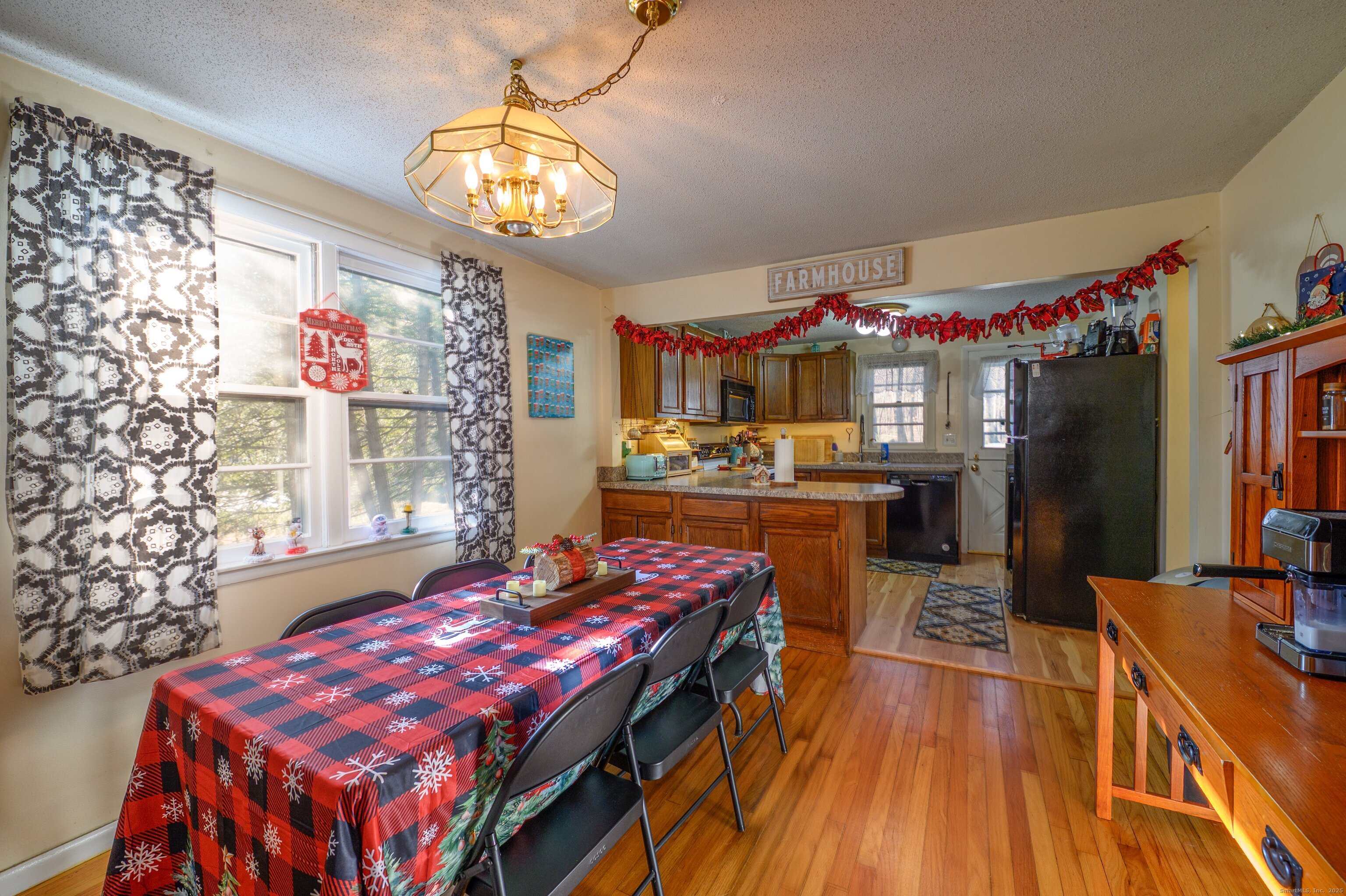 1940 Mt Vernon Road Southington, CT 06489 - Photo 5 of 24 a dining room with wooden floor and large window