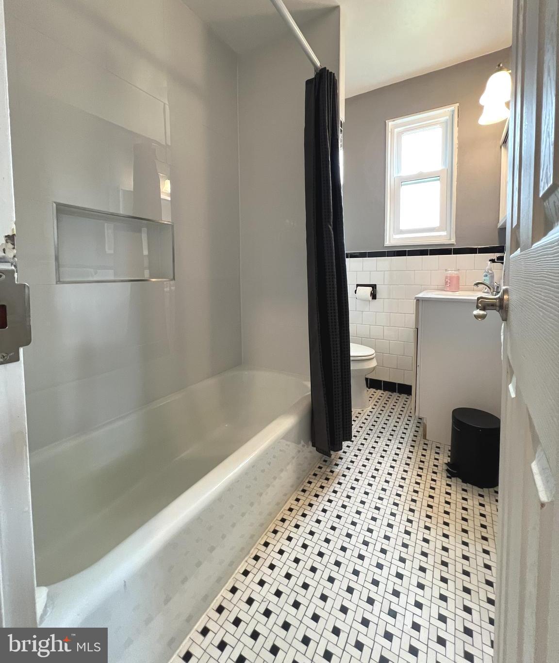 1001 Gabel Street Silver Spring, MD 20901 - Photo 20 of 46 a bathroom with a bathtub and a shower