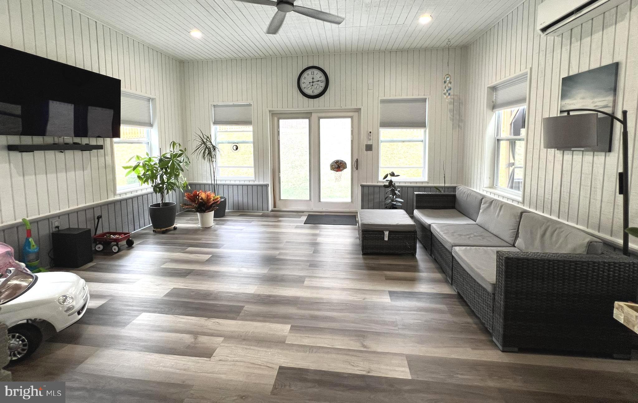 1001 Gabel Street Silver Spring, MD 20901 - Photo 32 of 46 a living room with furniture flat screen tv and a large window