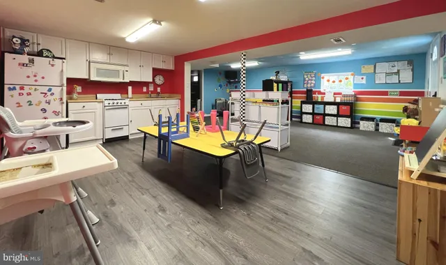 a living room with lots of furniture and wooden floor