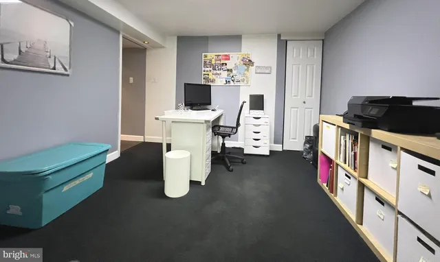 a very nice looking room with many windows and furniture