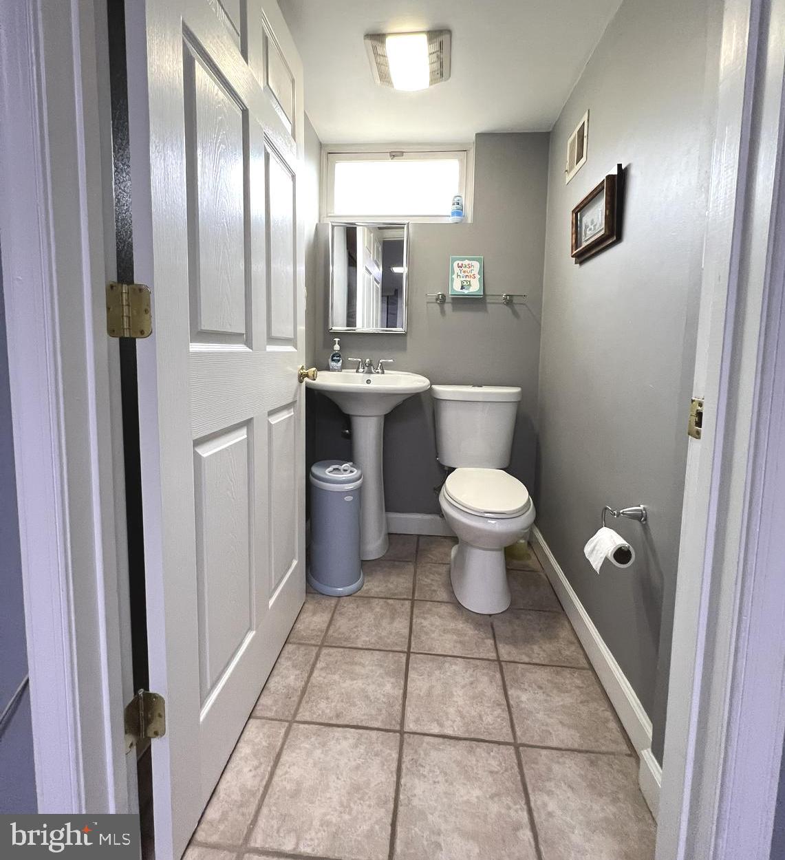 1001 Gabel Street Silver Spring, MD 20901 - Photo 44 of 46 a bathroom with a toilet sink and mirror