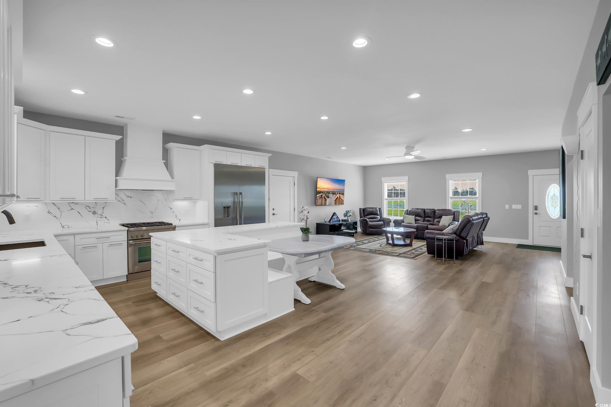 7356 Johnson Shortcut Road Conway, SC 29527 - Photo 40 of 40 Kitchen featuring premium appliances, premium range hood, light wood-style floors, recessed lighting, and open floor plan