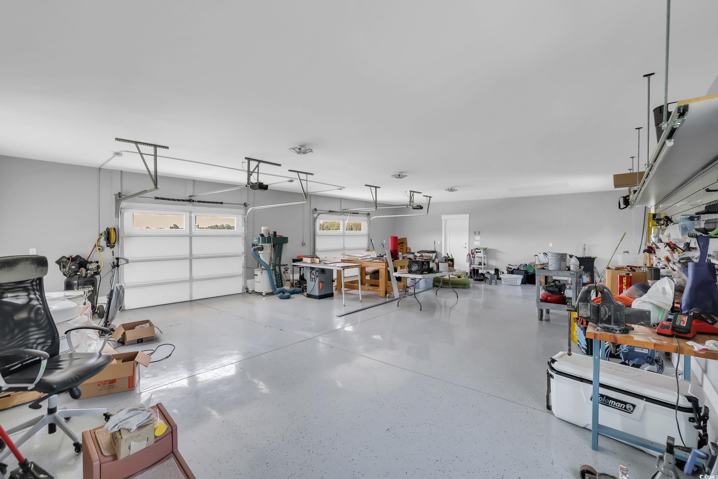 7356 Johnson Shortcut Road Conway, SC 29527 - Photo 31 of 40 Garage with a garage door opener and a workshop area