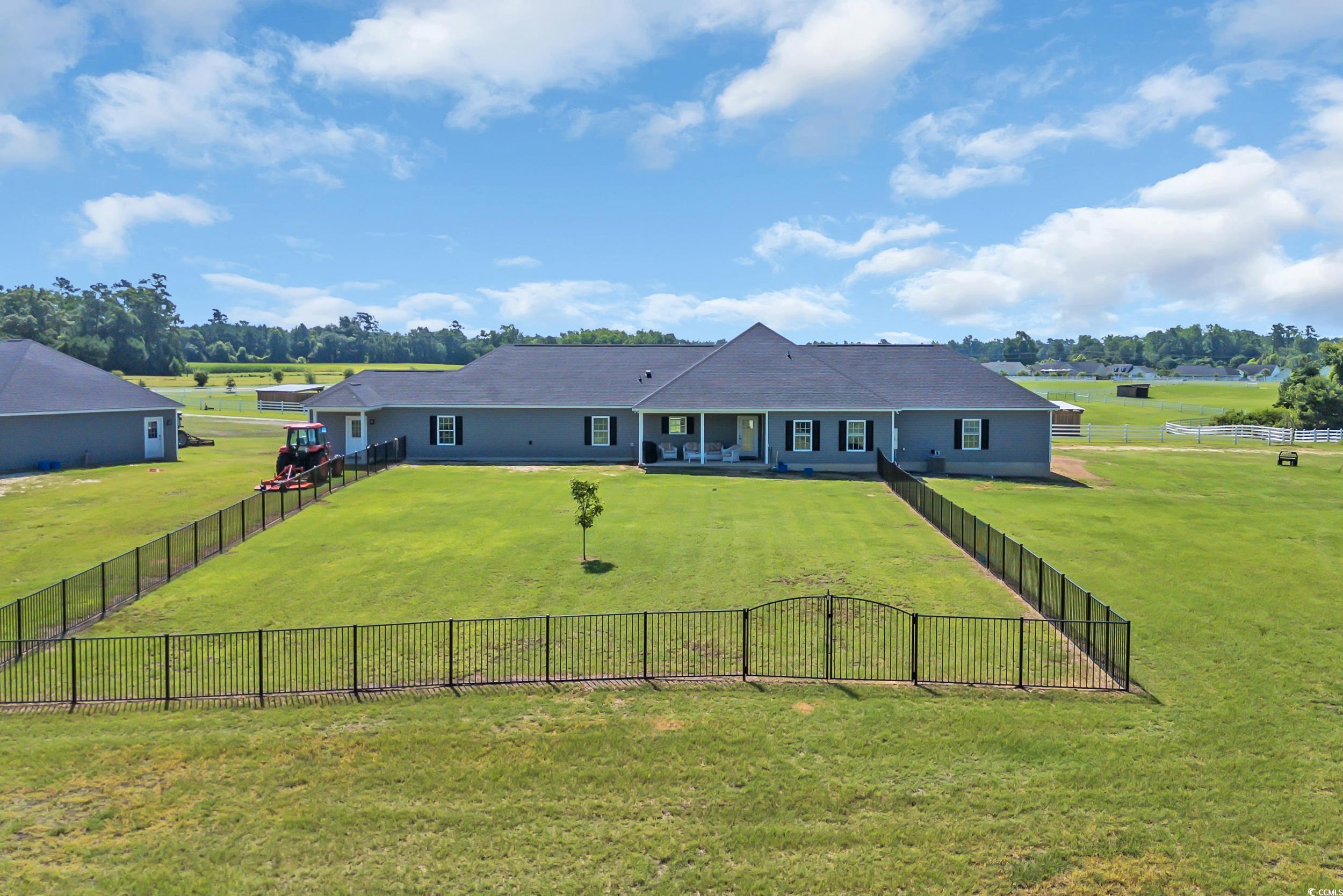 7356 Johnson Shortcut Road Conway, SC 29527 - Photo 5 of 40 Rear view of property with a fenced backyard and a view of rural / pastoral area