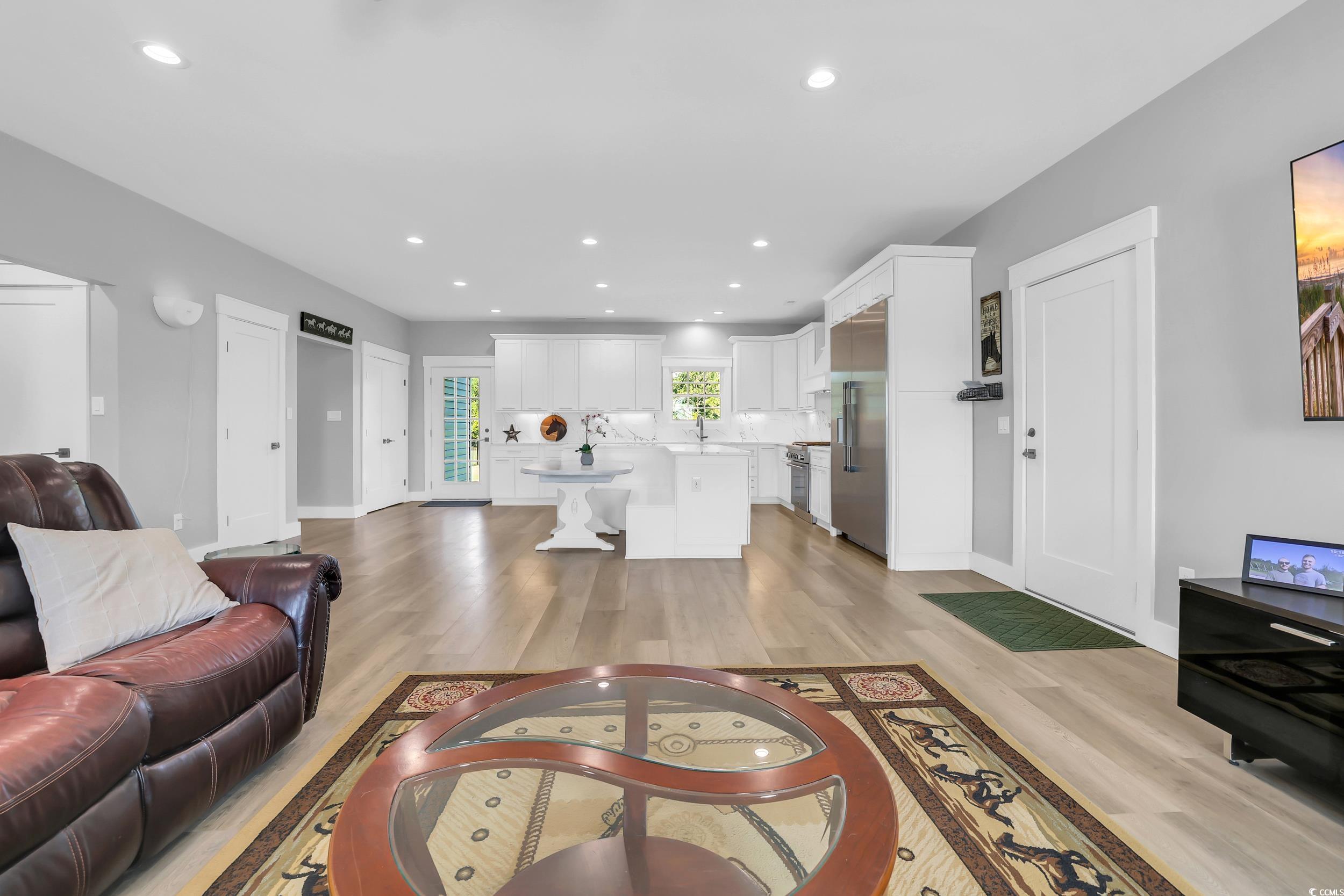 7356 Johnson Shortcut Road Conway, SC 29527 - Photo 10 of 40 Living room with light wood-style flooring and recessed lighting