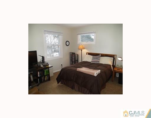 6 Taylor Road Princeton, NJ 08540 - Photo 7 of 10 a bedroom with a bed and a tv