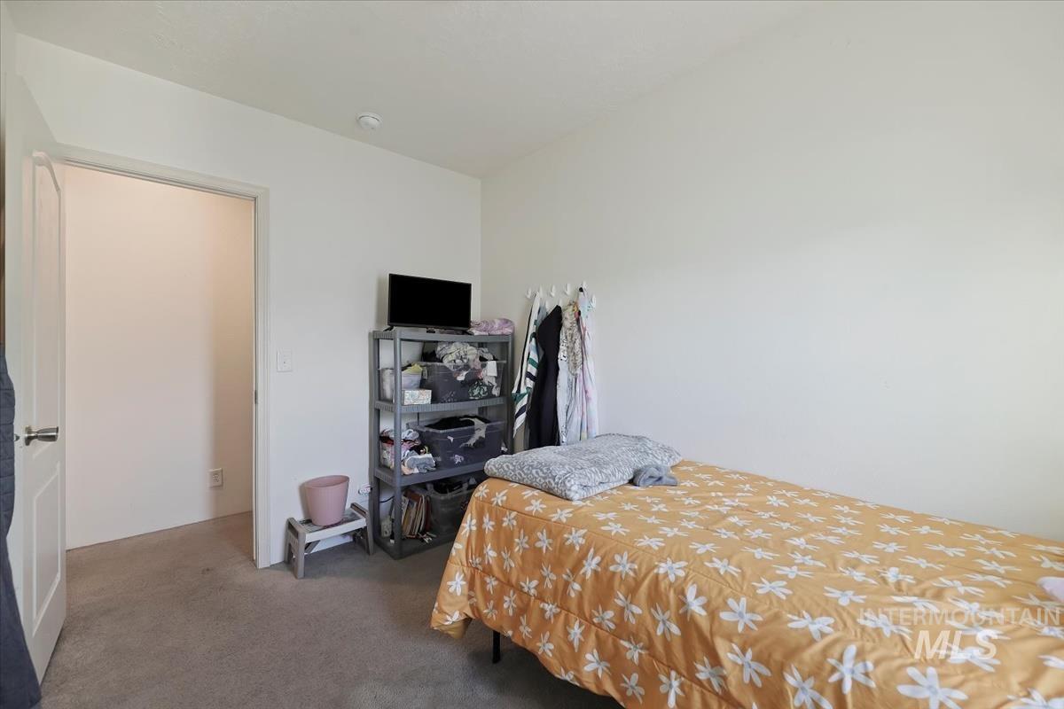 424 West Cherry Lane, Unit 94 Meridian, ID 83642 - Photo 15 of 31 Bedroom with carpet floors
