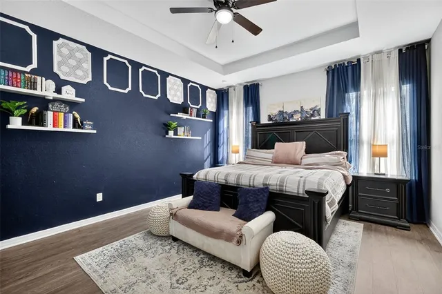 a bedroom with a large bed and a window