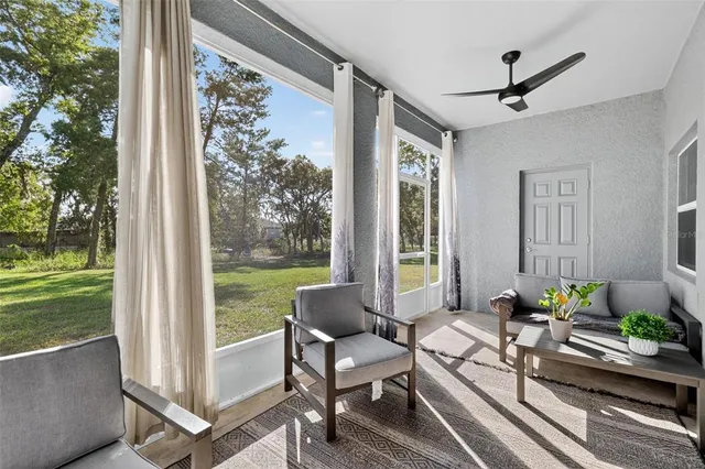 a outdoor space with patio the couches and a dining table with garden view