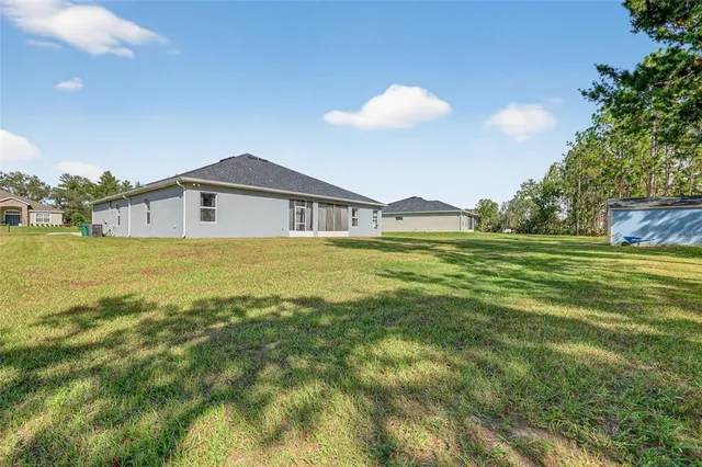 a view of a house with a big yard