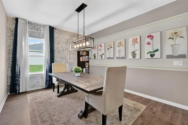 a workspace with furniture window and wooden floor