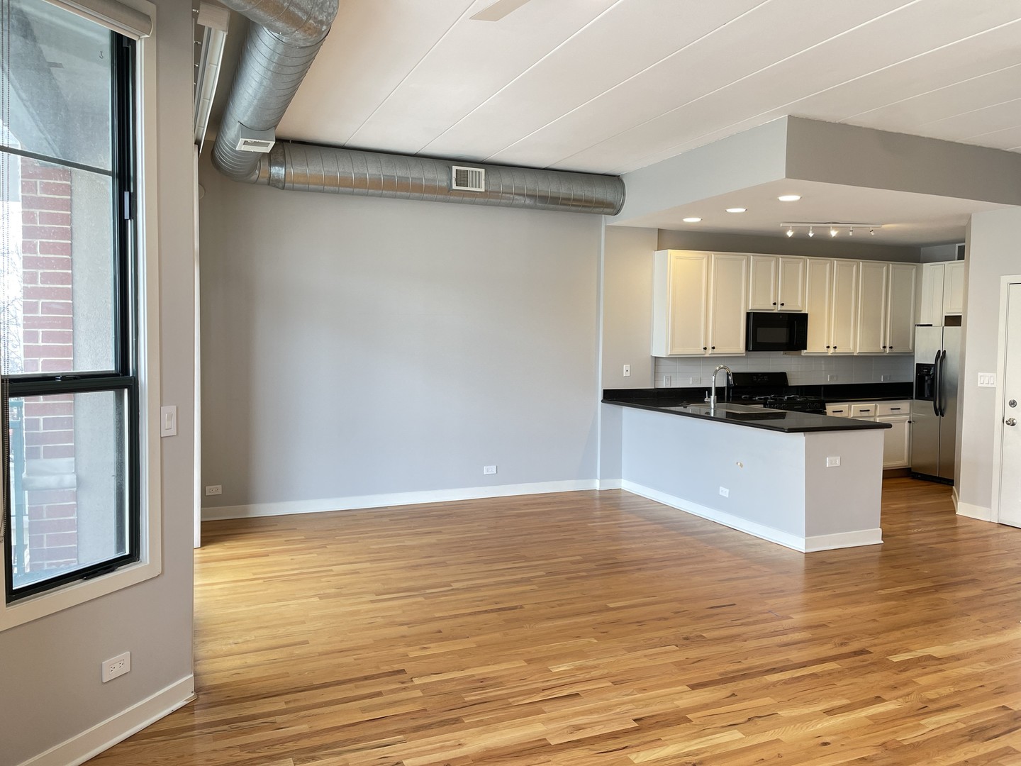 849 West Monroe Street, Unit 3F Chicago, IL 60607 - Photo 3 of 18 a view of kitchen with granite countertop stainless steel appliances sink and stove top oven
