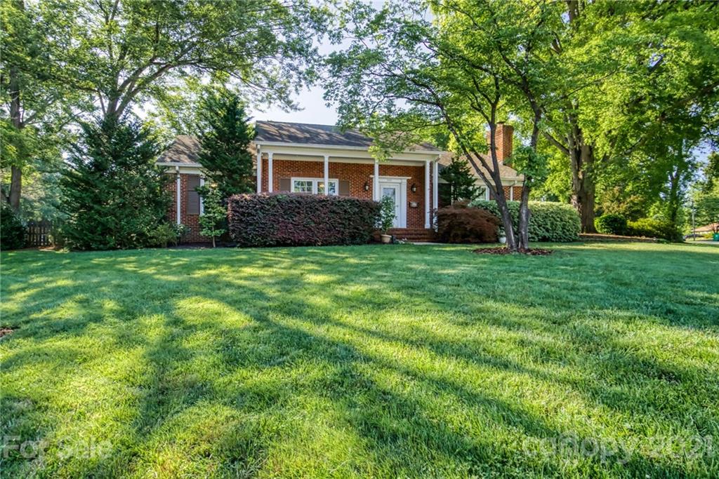 5401 Valley Forge Road Charlotte, NC 28210 - Photo 2 of 27 a view of a house with a yard and large trees