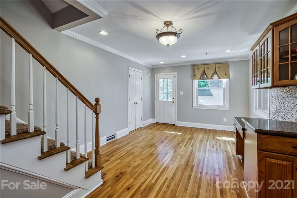5401 Valley Forge Road Charlotte, NC 28210 - Photo 11 of 27 a view of an empty room with wooden floor and a window